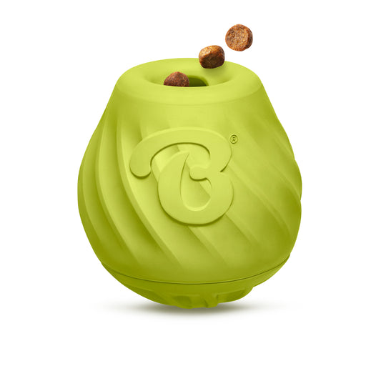 The Benebone Pawbler is a green rubber puzzle toy with a swirled texture and large B logo. It dispenses round brown treats from the top opening, offering your dog a fun mental workout. Pictured on a white background.