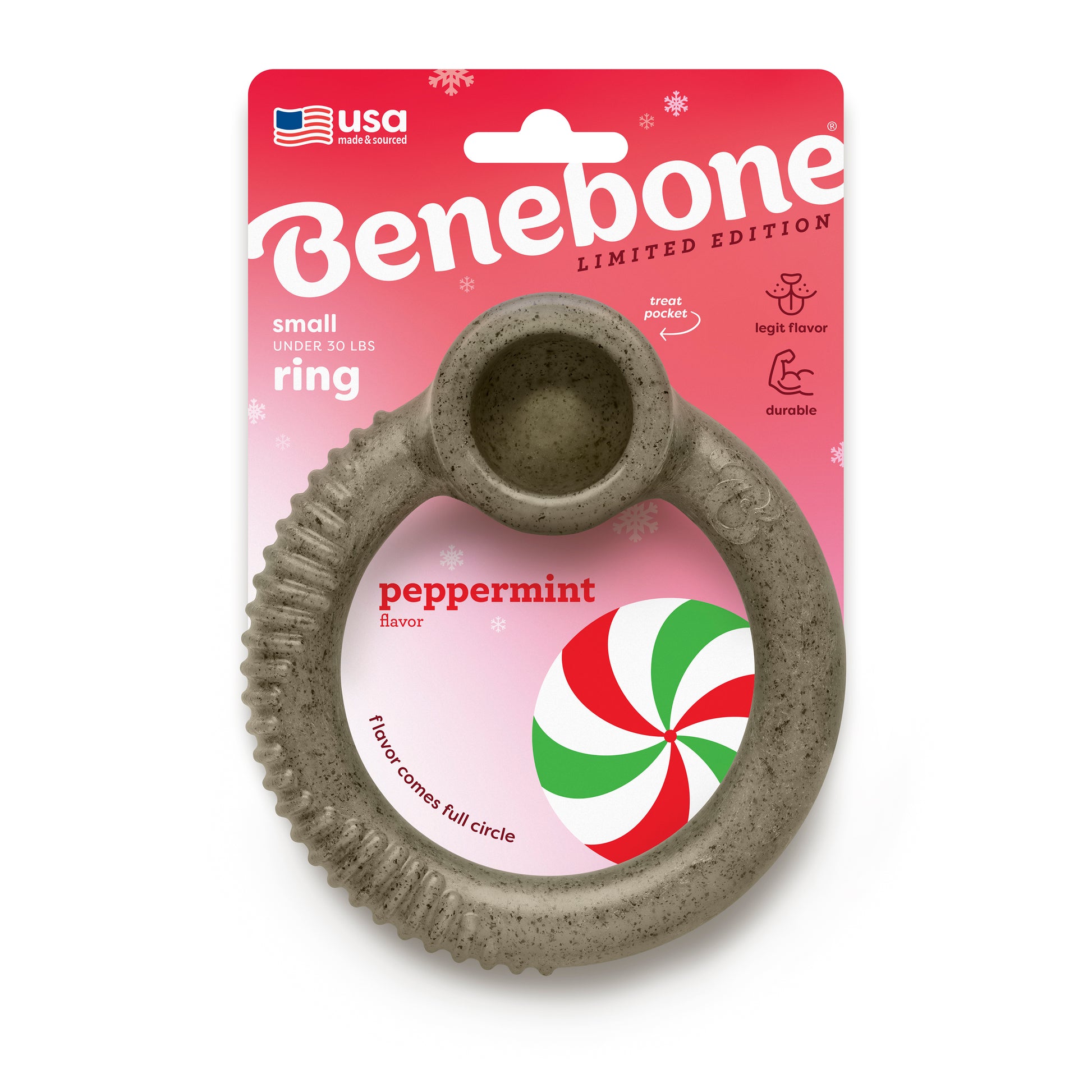A gray, ring-shaped Benebone Peppermint Ring dog chew for small dogs under 30 lbs in peppermint flavor, shown before red and white packaging with a festive peppermint candy image and holiday details.