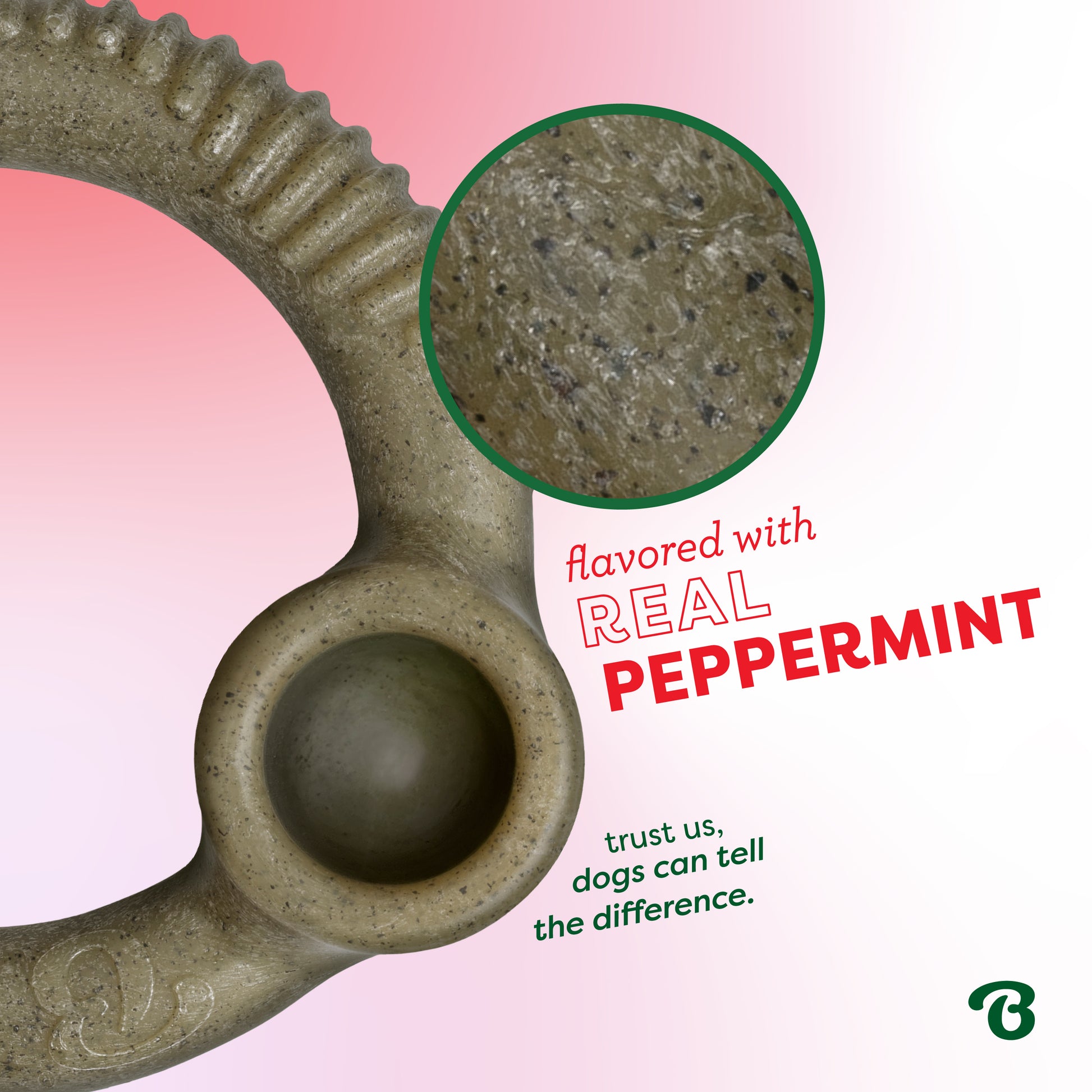 A close-up of the Benebone Peppermint Ring dog chew toy, highlighting its textured surface. Text: Flavored with real peppermint—dogs can tell the difference. Set on a pink gradient background.