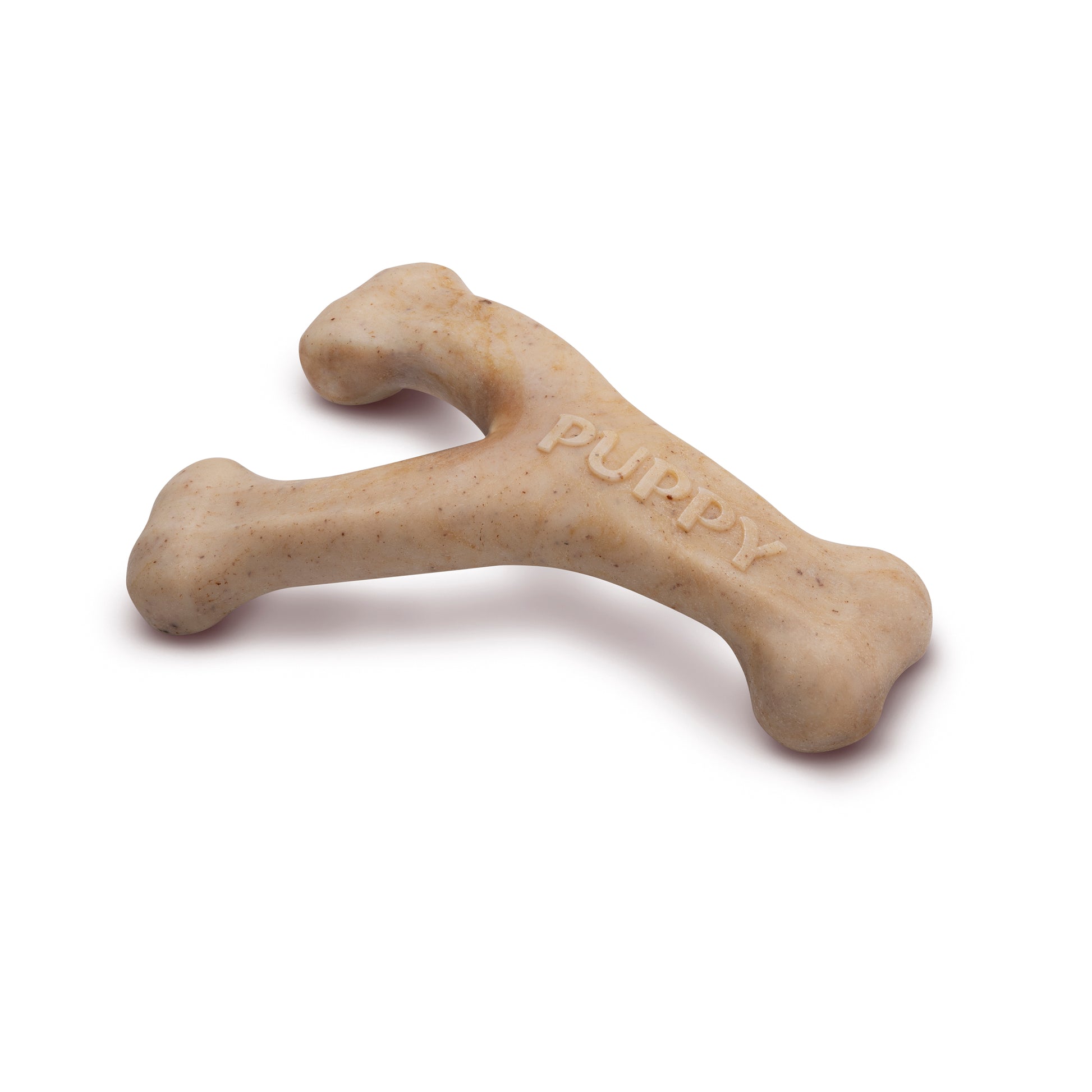 The Benebone Puppy Wishbone is a beige, Y-shaped chew toy resembling two joined bones, embossed with PUPPY, perfect for teething puppies and shown isolated on a white background.