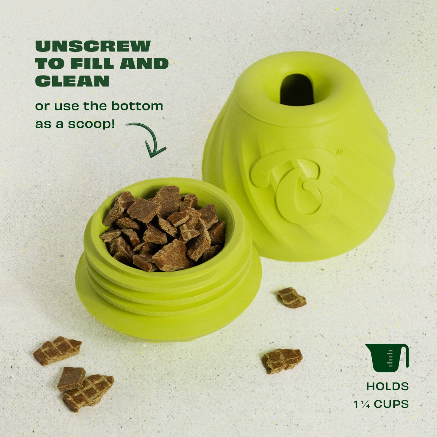 The Benebone Classic Chew Collection + Pawbler is a green, twist-apart container that holds 1¾ cups of brown pet treats. Unscrew to fill or clean, and use the base as a scoop. The interactive toy’s top is shown beside the treat-filled bottom.