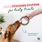 A brown dog licks a green textured ring toy from Benebone’s Limited Edition Chew Collection (50% off), held by a person. Text says, “Like a stocking stuffer for tasty treats,” with tips for adding yogurt or peanut butter. Bright minimal background.