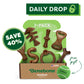Benebone’s Complete Chew Collection (7-Pack) is shown in an open box with durable chews in different shapes and a green “free gift” tennis ball. Above, the text reads “Daily Drop” and “Save 40%.”.