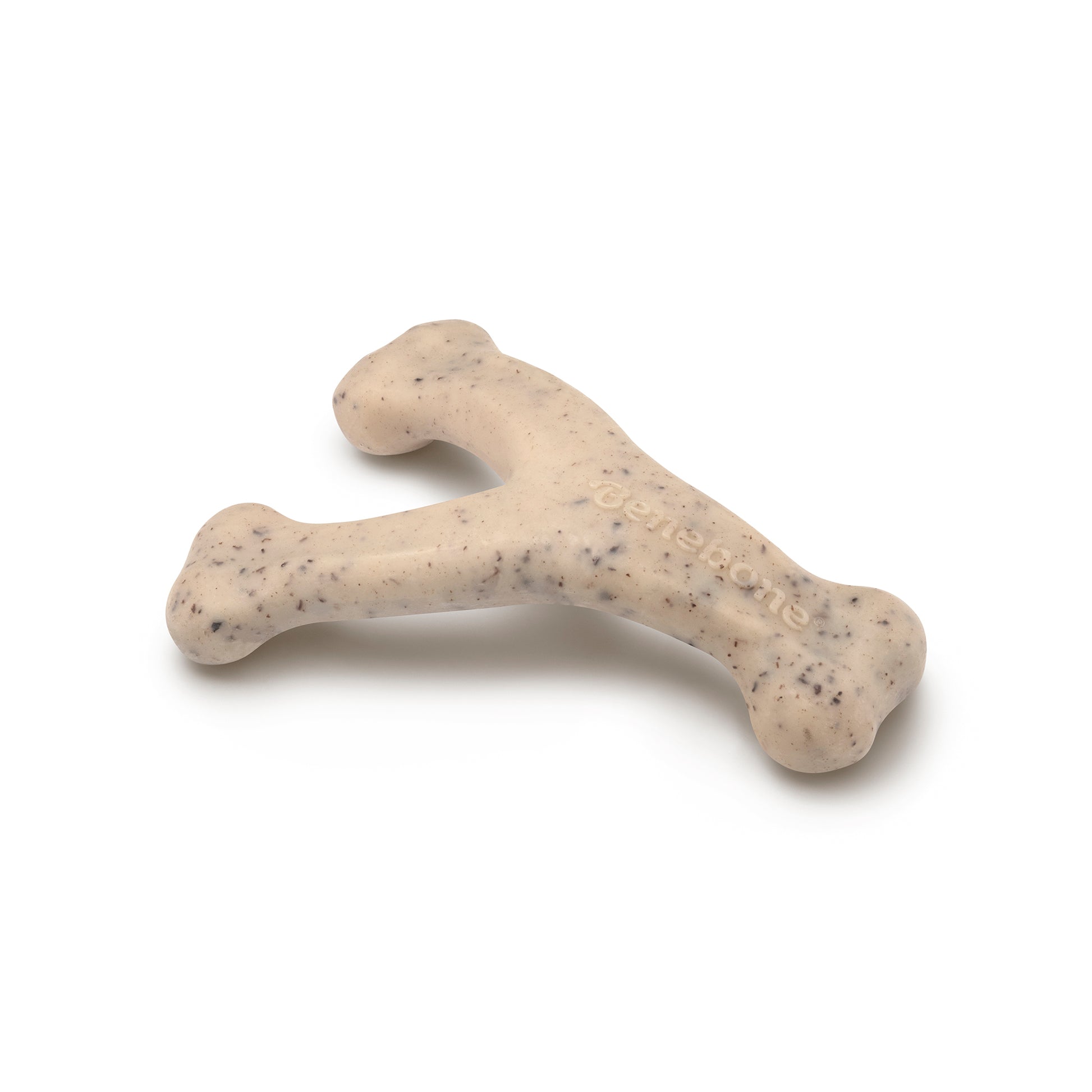 A green, Y-shaped dog chew with dark speckles and a slightly textured surface is shown on a white background. The word "Benebone" is embossed on one branch. Product: Green Wishbone by Benebone.