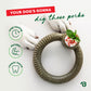 A dog grasps a Benebone Peppermint Ring chew toy with a treat on top. Text says, Your dog’s gonna dig these perks, and highlights long-lasting, durable, teeth-cleaning benefits with three green icons.