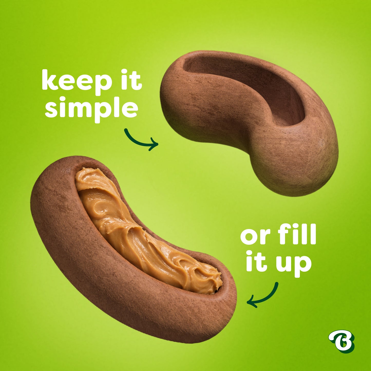 Two brown, bean-shaped objects sit on a green background; one is plain and labeled "keep it simple," while the other is filled with peanut butter and marked "or fill it up." A small B logo appears in the corner—perfect as Benebone Treat Pod for Tongue Twister refills to enhance your interactive dog toys or to use as tasty dog treats.