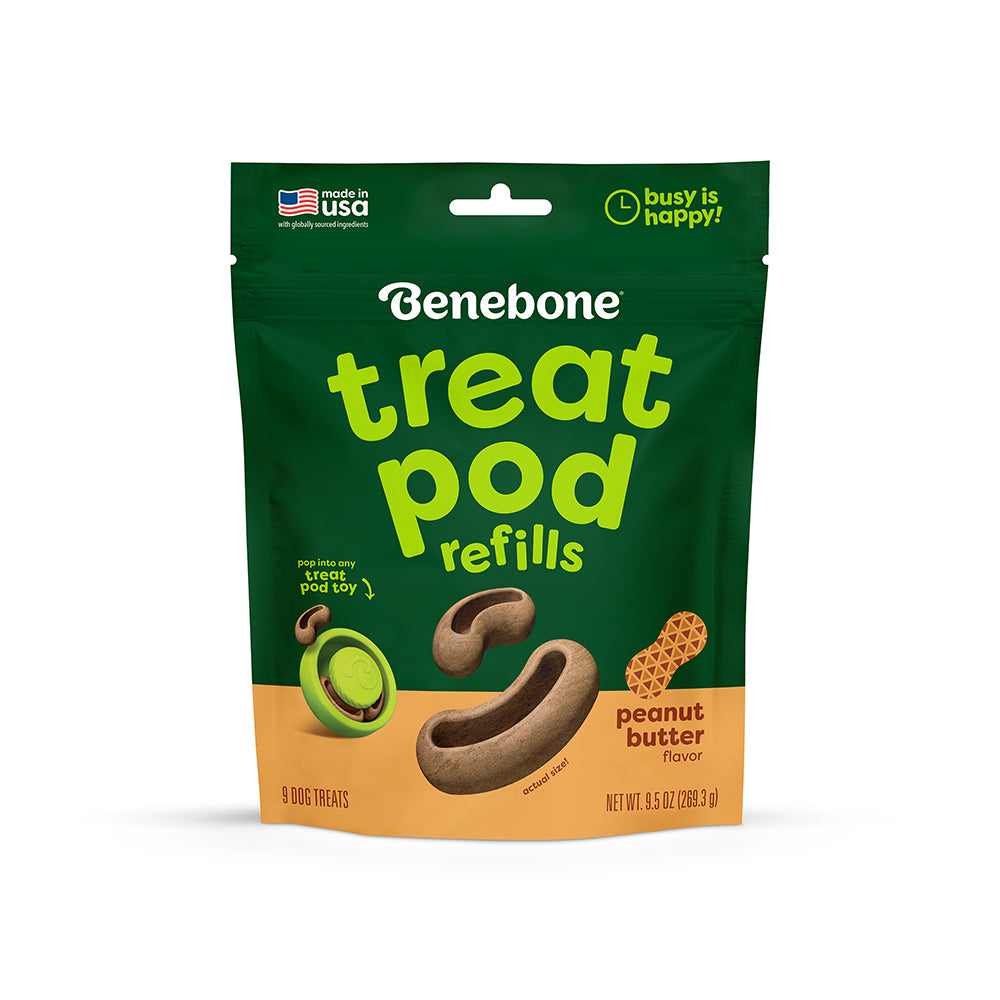 Green and tan bag of Benebone Treat Pod for Tongue Twister refills, peanut butter flavor, featuring dog treat shapes on the front. The package states it is made in the USA and designed for use with pod toys like the Treat Pod or Tongue Twister.