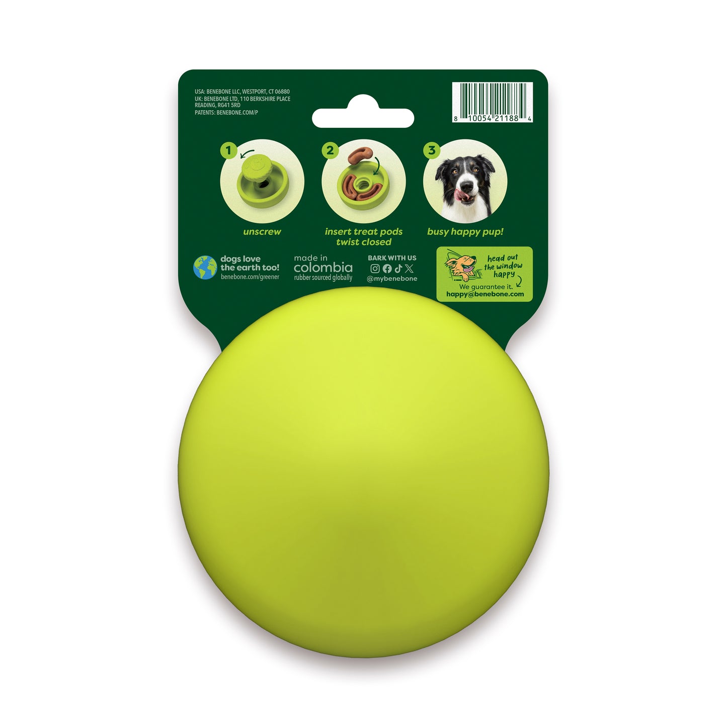 A round, bright yellow Benebone Tongue Twister dog puzzle toy, made from natural rubber, comes in packaging featuring instructions and a photo of a dog on the back, demonstrating how to insert treats by unscrewing and twisting the toy.
