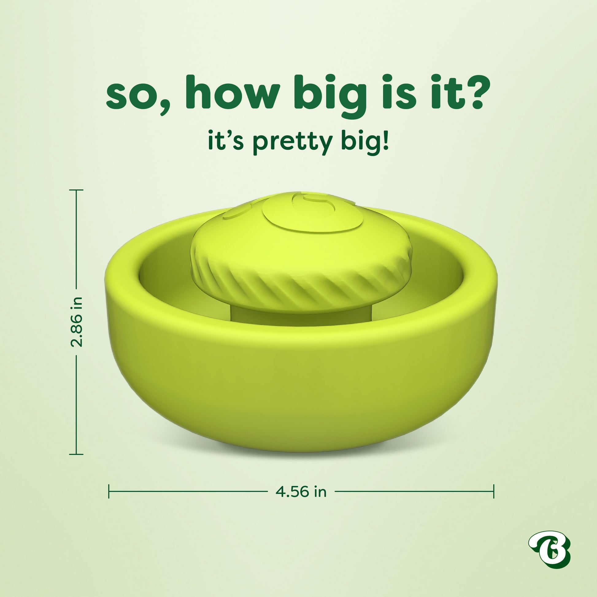 Green circular pet toy called the Benebone Tongue Twister, featuring a textured raised center and crafted from natural rubber as an interactive puzzle to support dog enrichment. Text reads, "So, how big is it? It's pretty big!" Measurements: 2.86 inches tall and 4.56 inches wide. Bustle logo in the bottom right corner on a pale green background.
