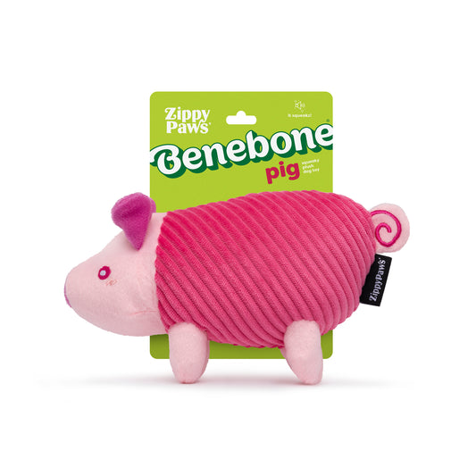 A pink squeaky Benebone x ZippyPaws Plush pig dog toy on its display card.