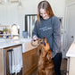 Women with benebone shirt and Dog with Benebone in mouth